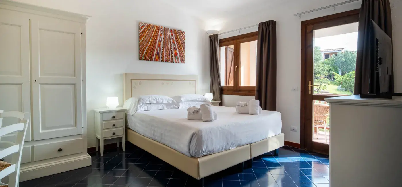 Bedroom view of Felix Hotels - Residence Hotel Costa Serena, Italy